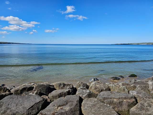 clear water with a hint of a wave in front of the shop